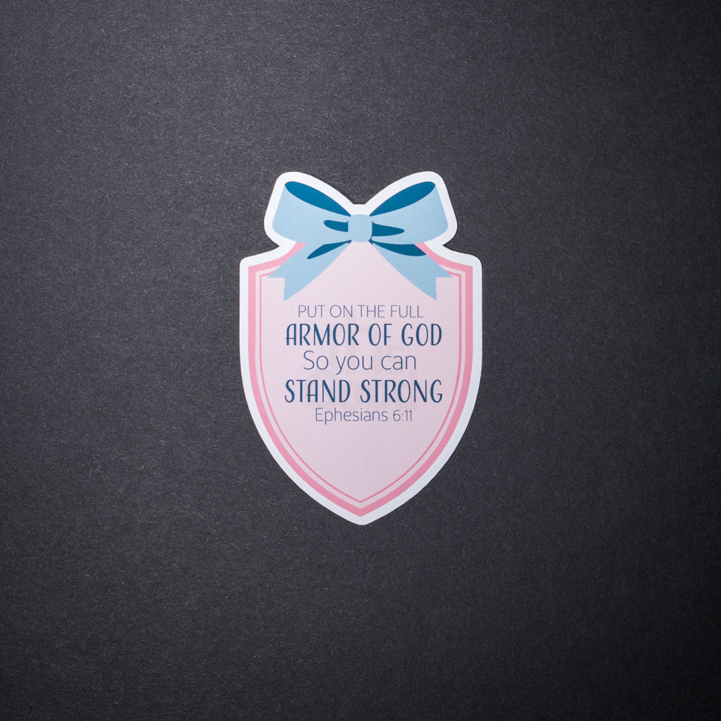 Armor of God sticker with pink shield, blue bow, and Ephesians 6 11 text