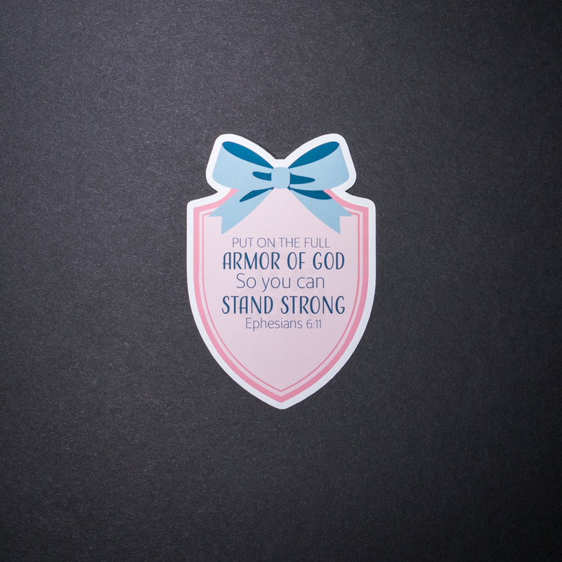 Armor of God sticker with pink shield, blue bow, and Ephesians 6 11 text