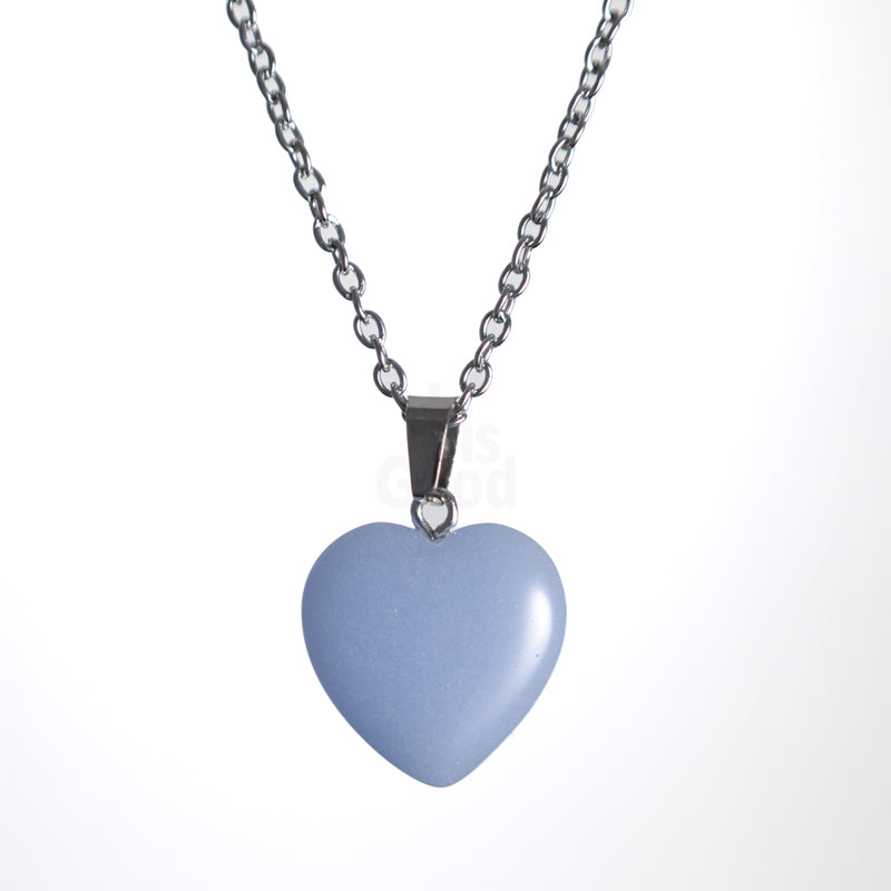 Blue Glow in the dark heart necklace on stainless steel chain
Minimal heart pendant necklace with soft glow
Christian heart necklace photographed on white background