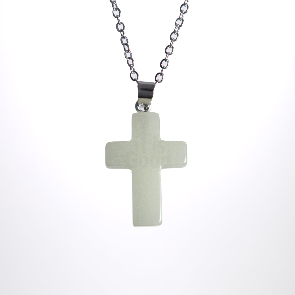 Glow in the dark cross necklace on stainless steel chain
Minimal Christian cross pendant necklace
Cross necklace with soft glow photographed on white background