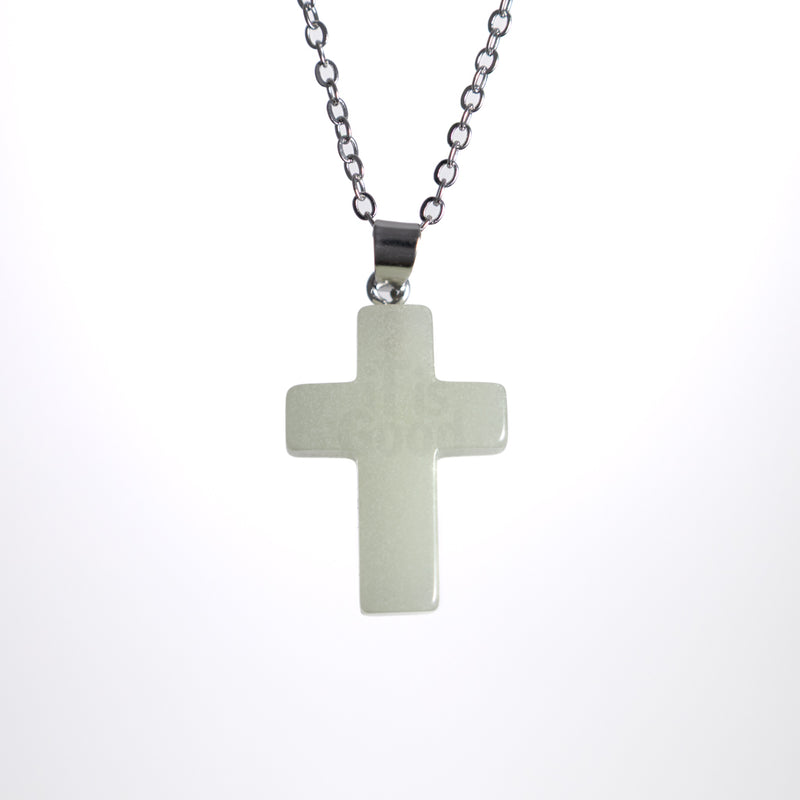 Glow in the dark cross necklace on stainless steel chain
Minimal Christian cross pendant necklace
Cross necklace with soft glow photographed on white background