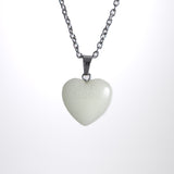 Green Glow in the dark heart necklace on stainless steel chain
Minimal heart pendant necklace with soft glow
Christian heart necklace photographed on white background
