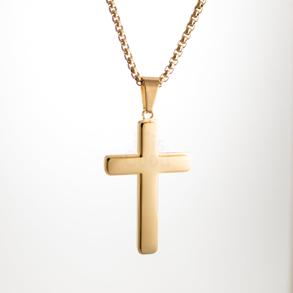 Gold polished cross pendant necklace on gold chain, smooth reflective finish, minimalist faith jewelry, front view on white background.