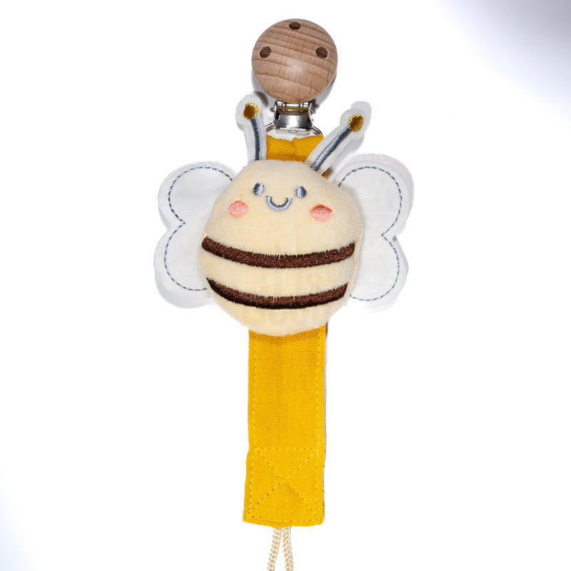 Baby pacifier clip featuring a plush smiling bee with soft wings, a yellow fabric strap, and a wooden clip on a white background, designed for babies and toddlers