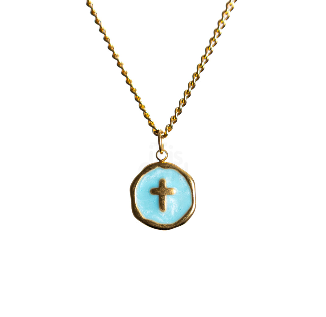 Gold chain necklace with round Blue pendant featuring a small cross at the center on a white background