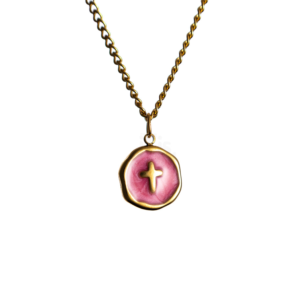 Gold chain necklace with round Hot Pink pendant featuring a small cross at the center on a white background