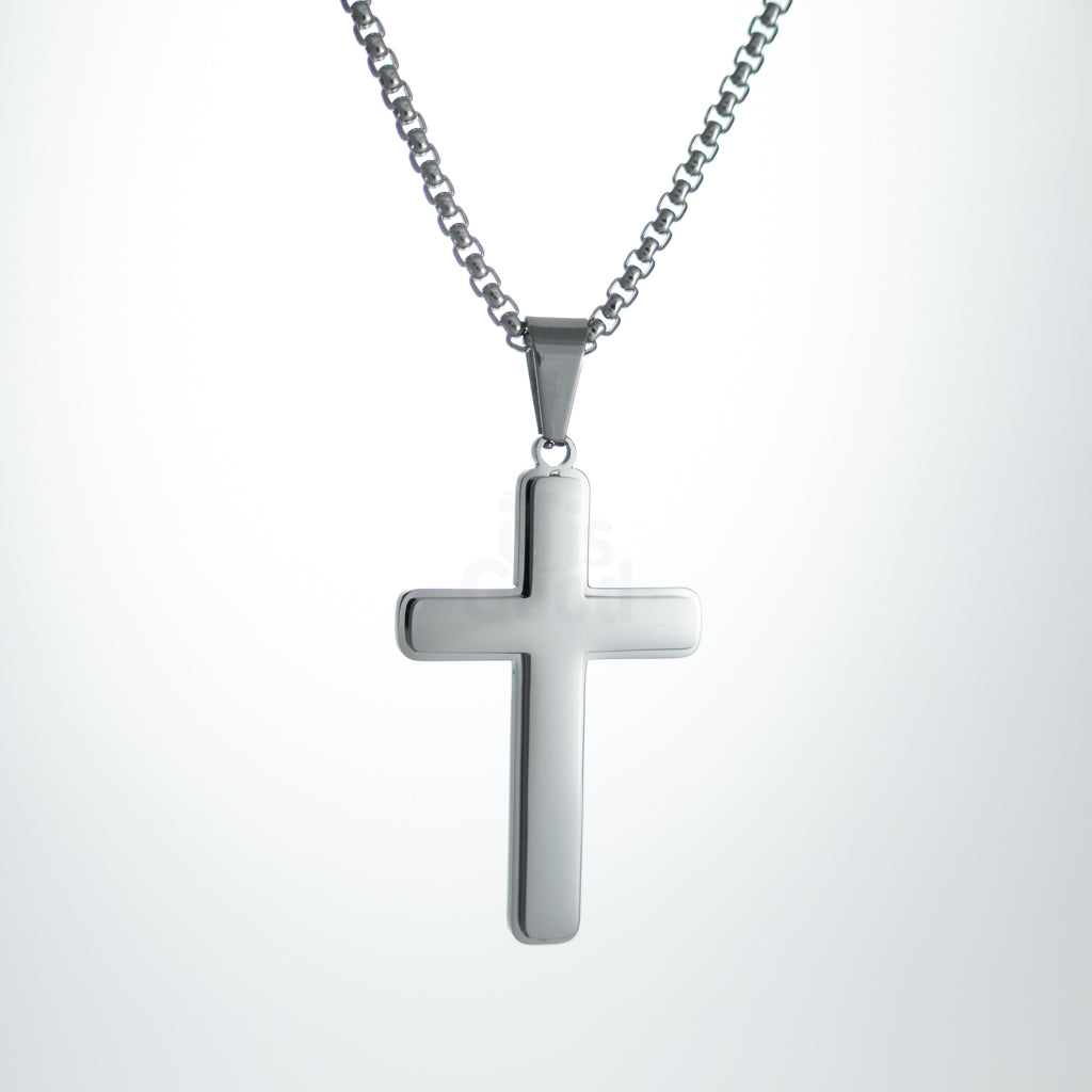 Silver polished cross pendant necklace on silver chain, minimal classic Christian jewelry, front view on white background.
