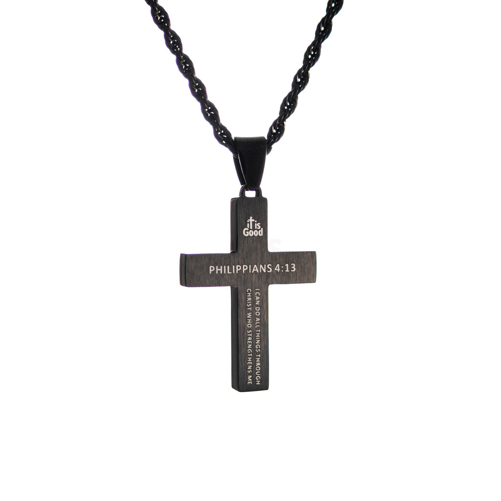 Black cross pendant necklace with textured two tone inlay detail and black rope chain, centered on white background. with engraving of Philippians 4:13