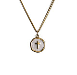 Gold chain necklace with round White pendant featuring a small cross at the center on a white background
