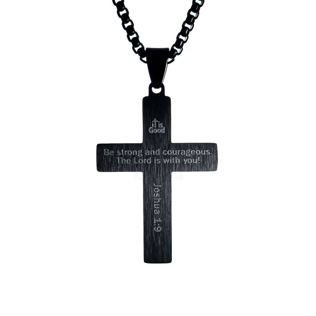 Necklace back engraving reads Be strong and courageous The Lord is with you, Scripture reference engraved, black chain on white background.