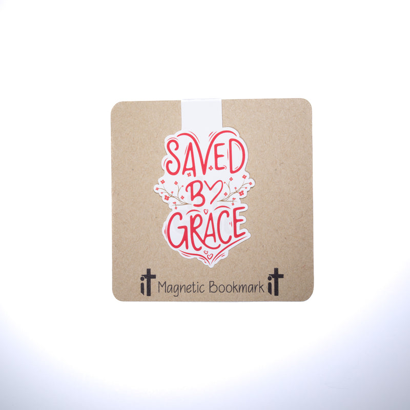 Double sided magnetic bookmark featuring red hand lettered text reading Saved by Grace with floral accents on a kraft style background, designed for Christian reading and Bible study