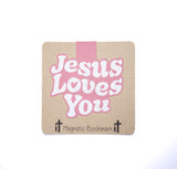 Double sided magnetic bookmark featuring the phrase Jesus Loves You in pink lettering on a kraft style background, designed for Christian reading and Bible study