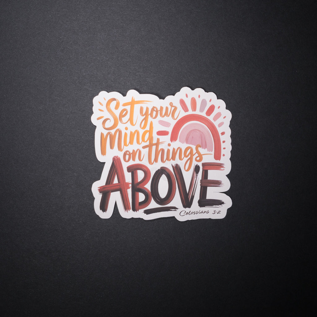 Set your mind on things above Christian sticker with pastel rainbow and sunrise on dark background